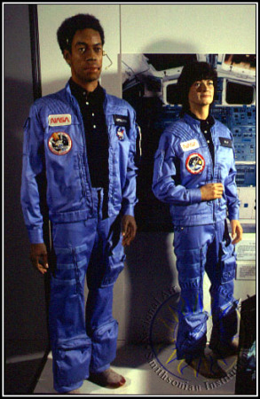 Sally Ride's in-flight suit, next to that of another pioneering astronaut, TK, the first African-American in space. Photo by Eric Long, courtesy of the Smithsonian National Air and Space Museum.